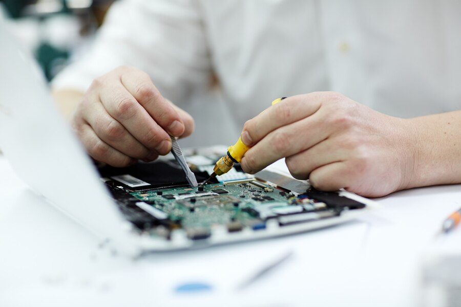 male hands repairing laptop 1098 14334